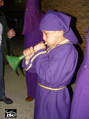 Penitent playing the trumpet